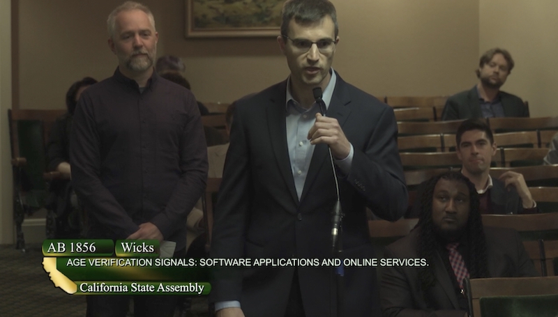 me standing in front of a microphone to voice my opposition to legislators